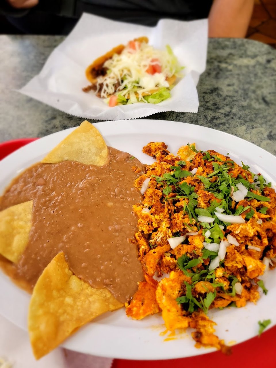 Restaurant menu with comfort food and small plates.